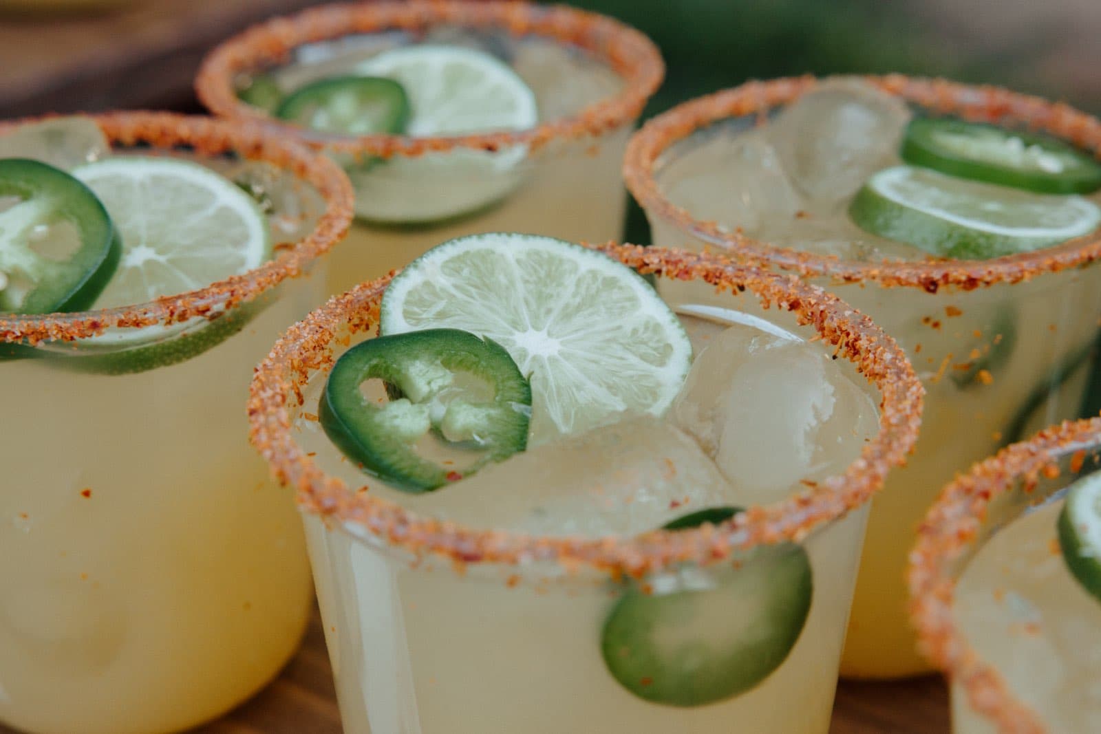 Chili-lime margaritas with a Tajin rim, jalapeno and lime garnish